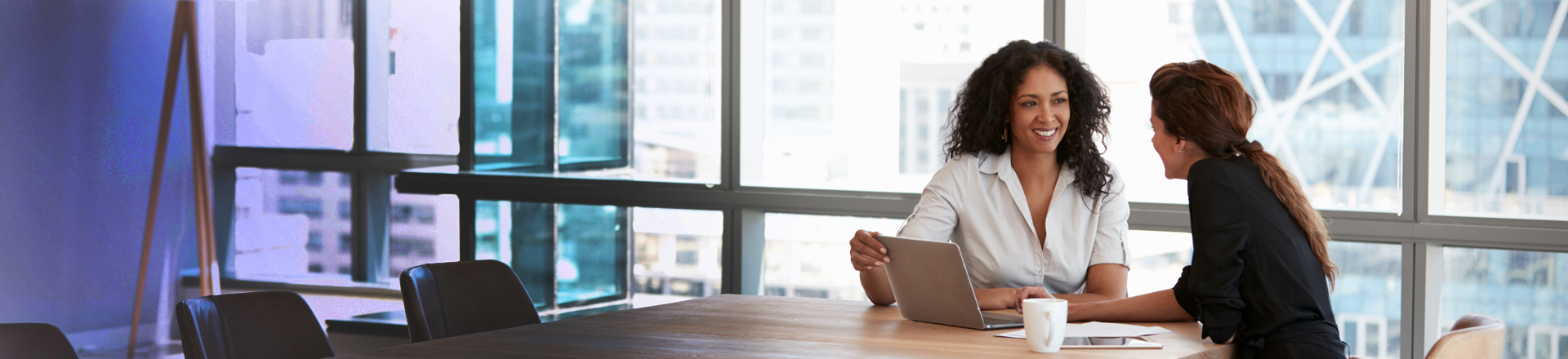 Two business women in a meeting. Two business women in a meeting.